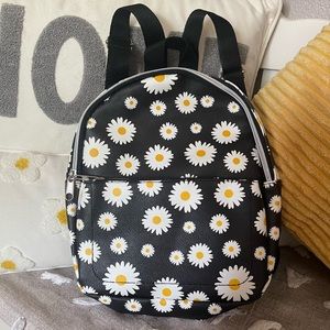 Super cute black with Daisy patterned small backpack!